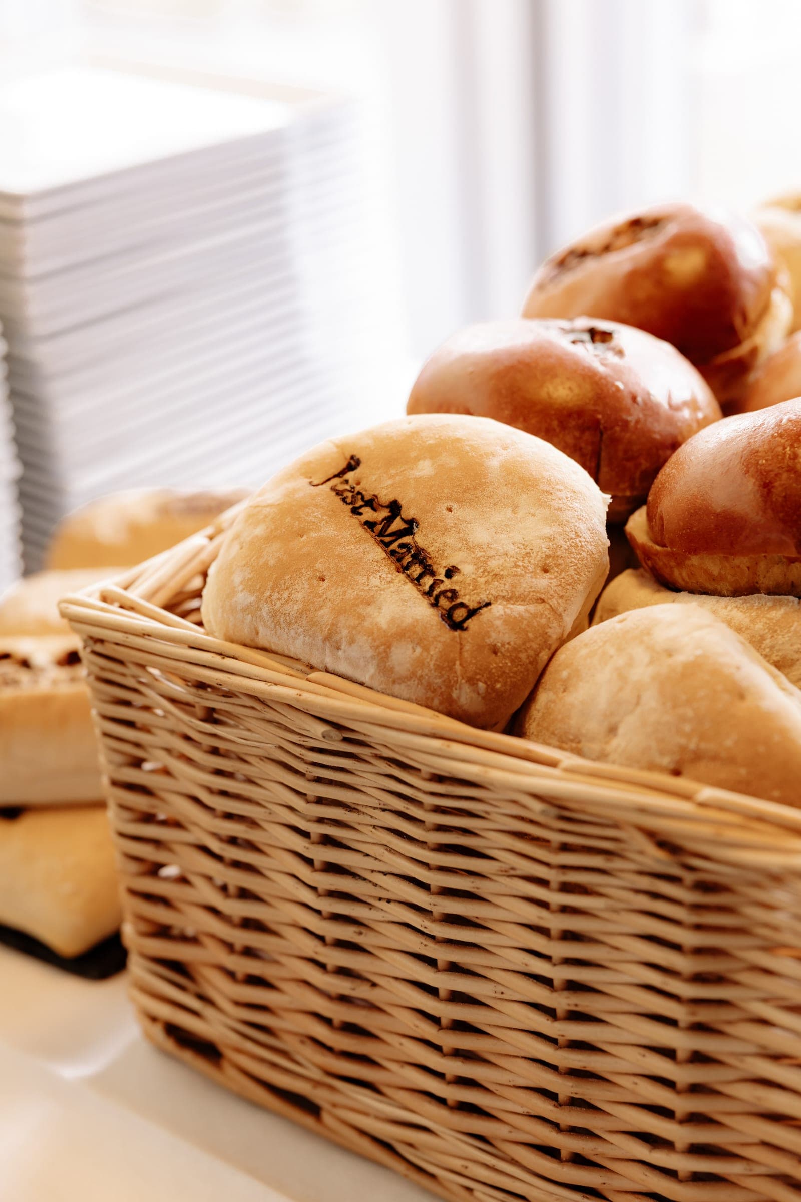 Baskets of fresh bread laid out for the wedding breakfast