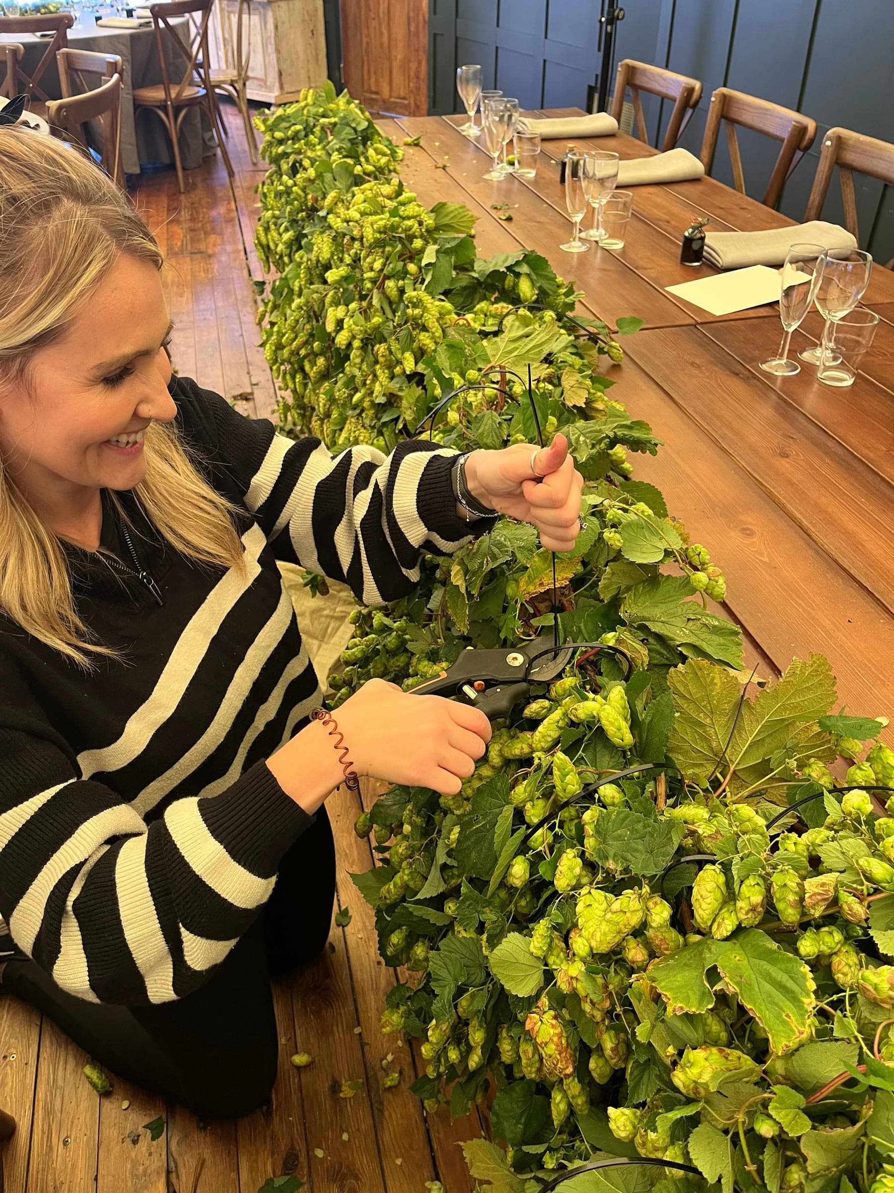 Dressing a table with foliage ahead of the wedding breakfast